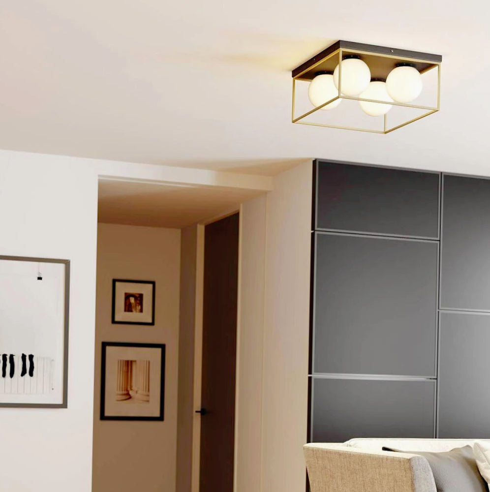 Plafoniera minimalista in metallo nero e bronzo con 4 sfere opache - attacco G9 - ambraled
