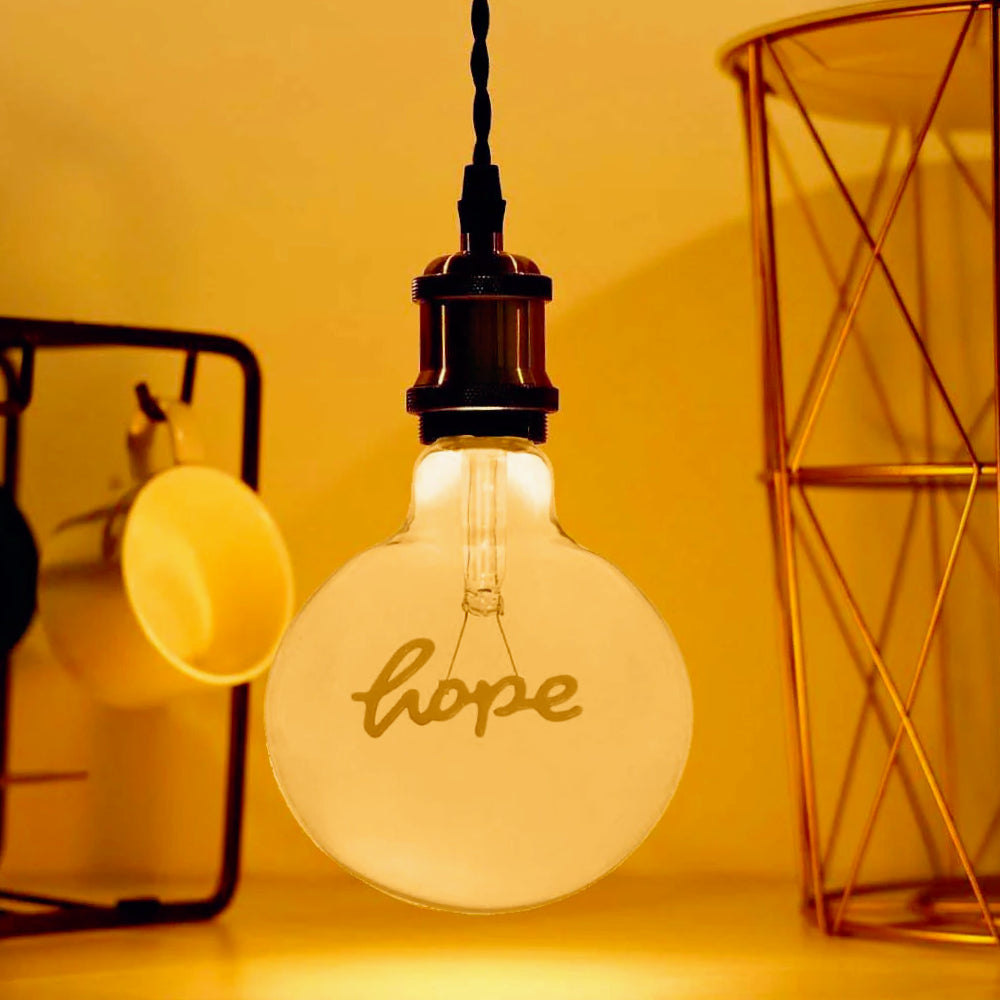 Lampadina LED a filamento ambrata E27 4W – Scritta "HOPE", luce calda - ambraled